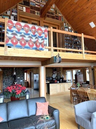 Open-concept kitchen and living area below the loft