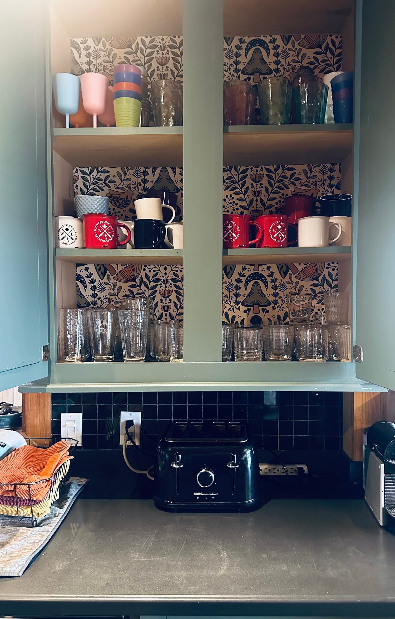 Coffee bar with mugs and glassware