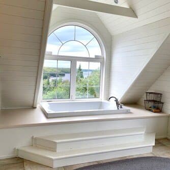 Soaker tub under the arched window