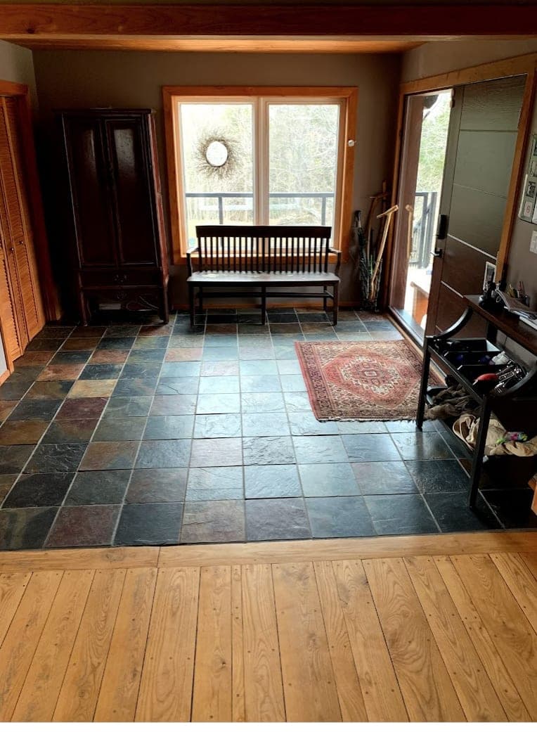 Entrance hall with slate floor and bench