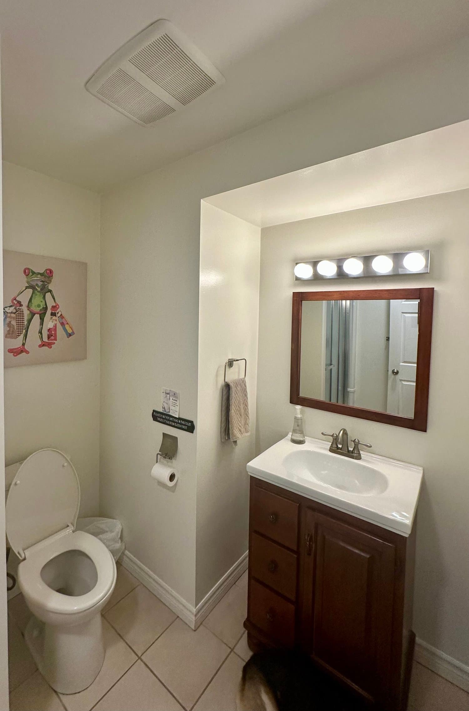 Bathroom with vanity and mirror
