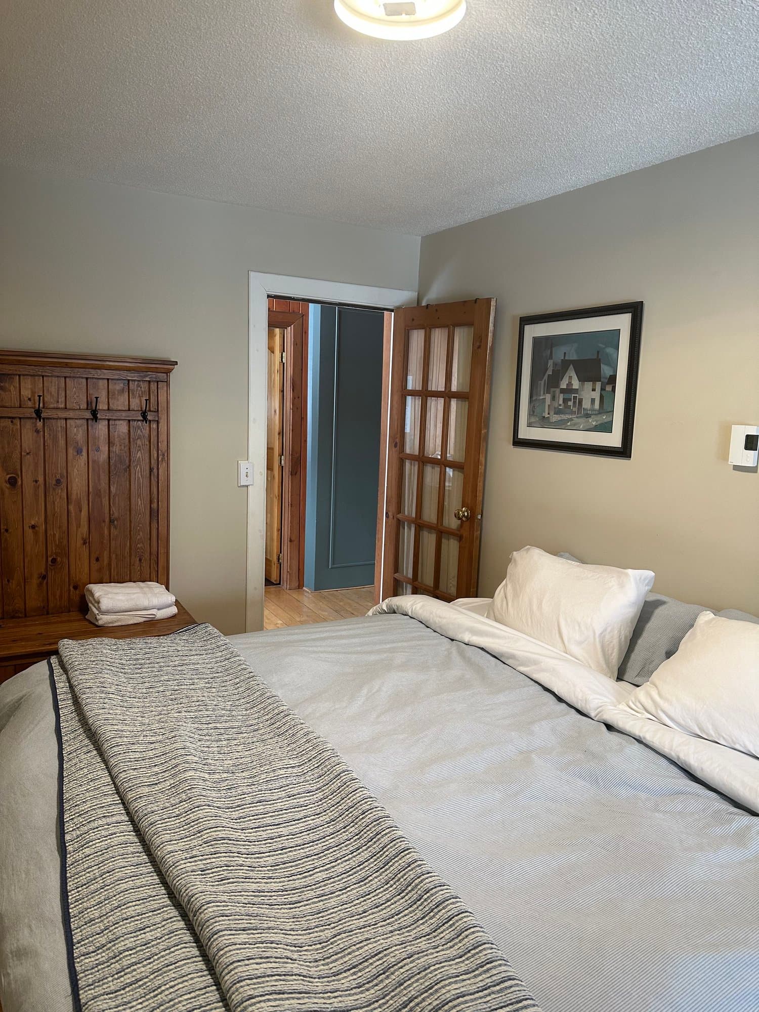 Bedroom with a king bed and armoire