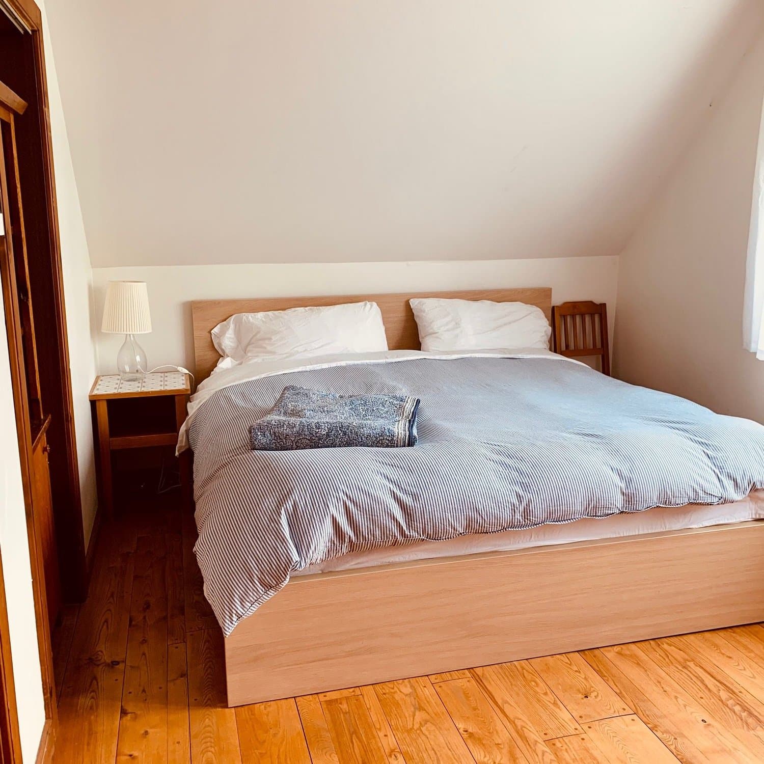 Queen bedroom with pine floors