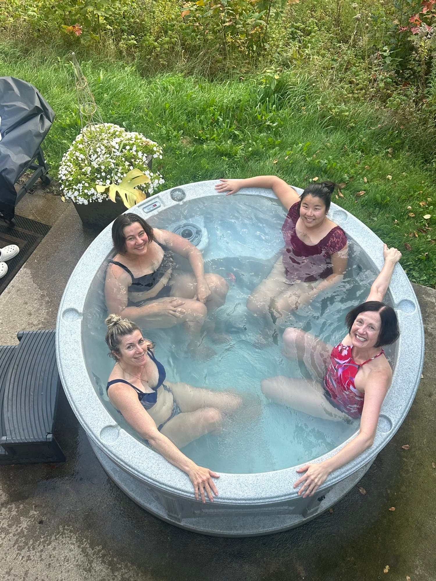 Guests relaxing in the outdoor hot tub