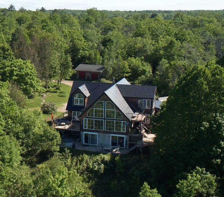Aerial view of the cottage in the forest