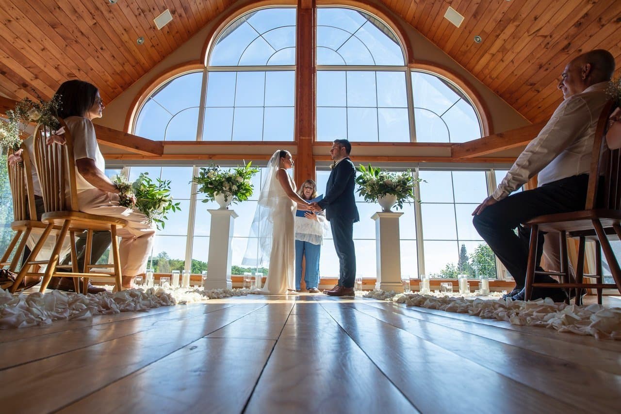 Wedding ceremony in front of the great room windows