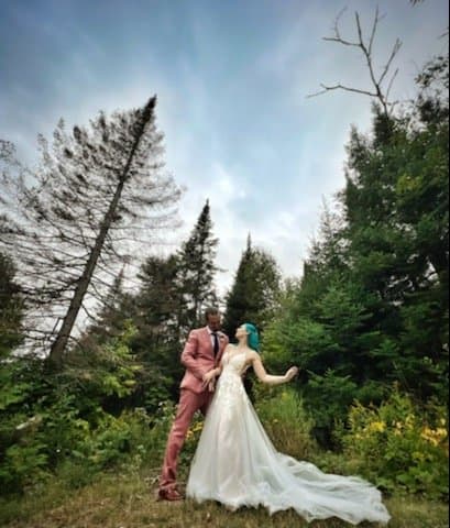 Couple in a forest clearing