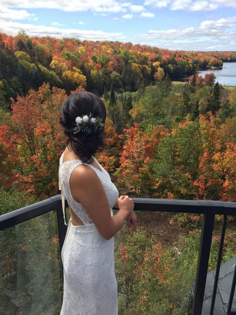 Bride overlooking the fall colours from the deck