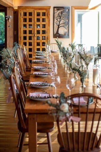 Long reception table set for dinner