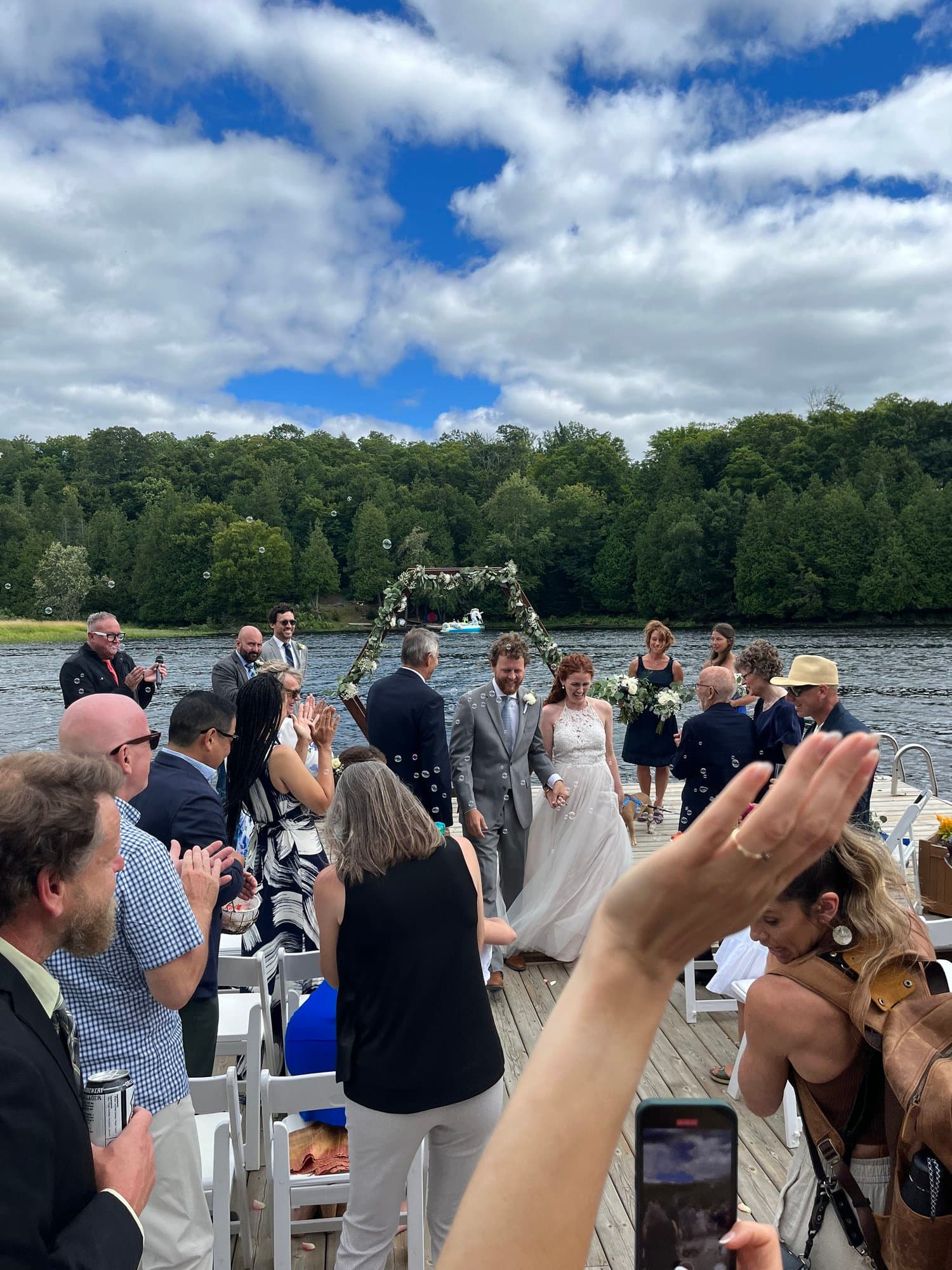 Guests at a dockside ceremony