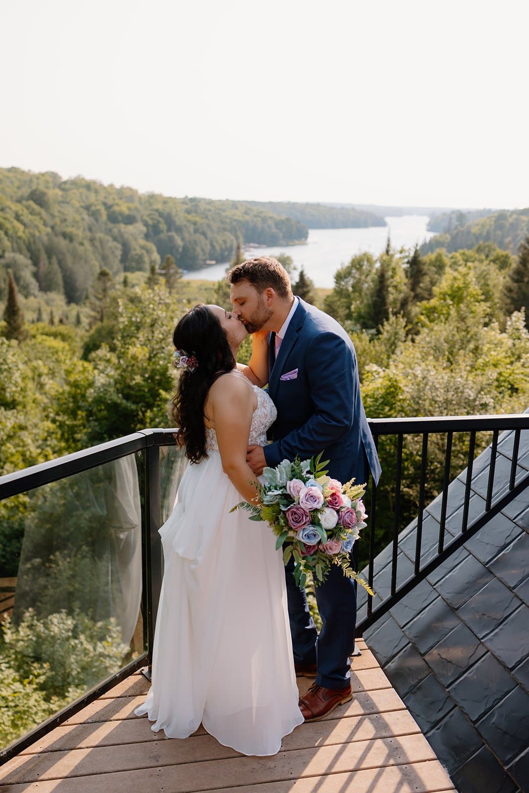 Couple kissing on the deck