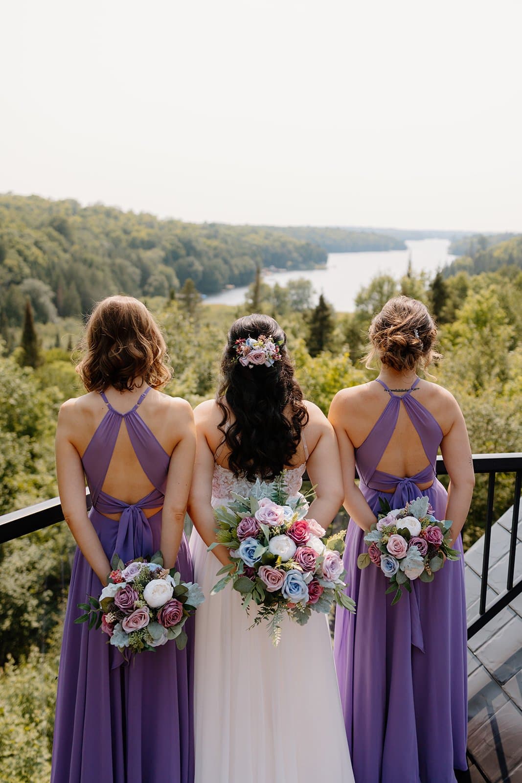 Bride and bridesmaids overlooking the lake