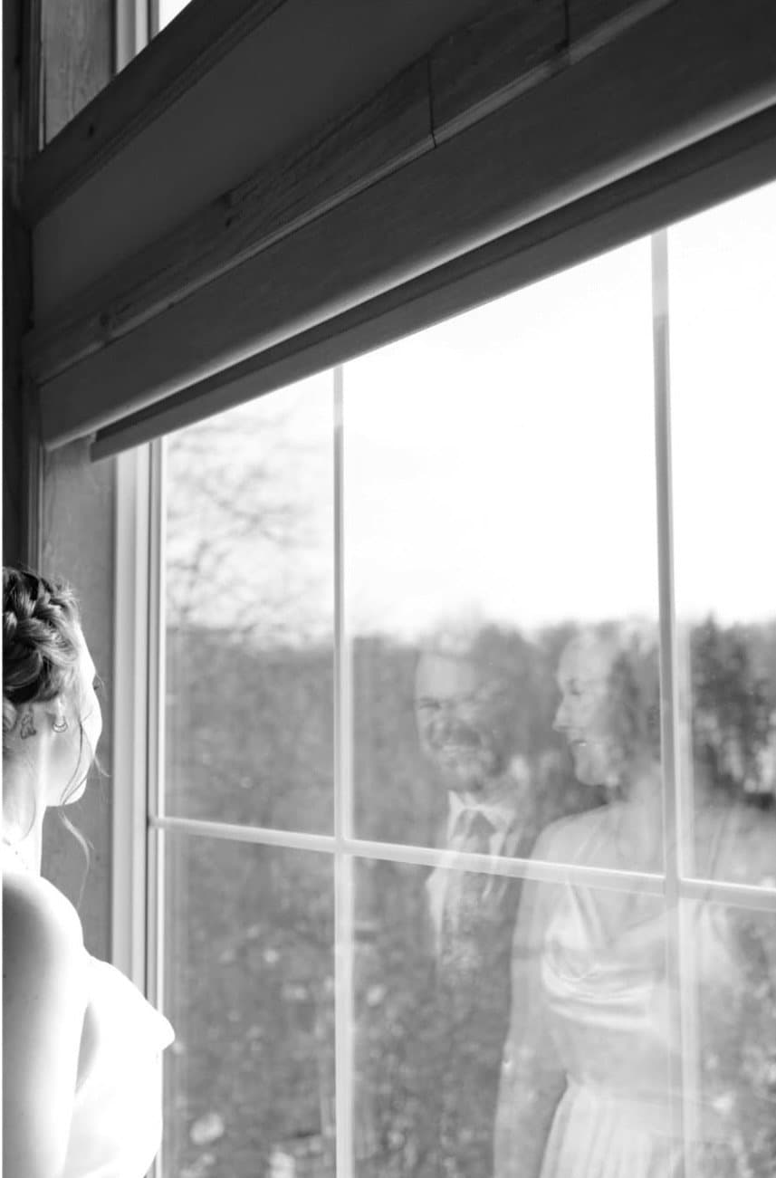 Bride by the window in black and white