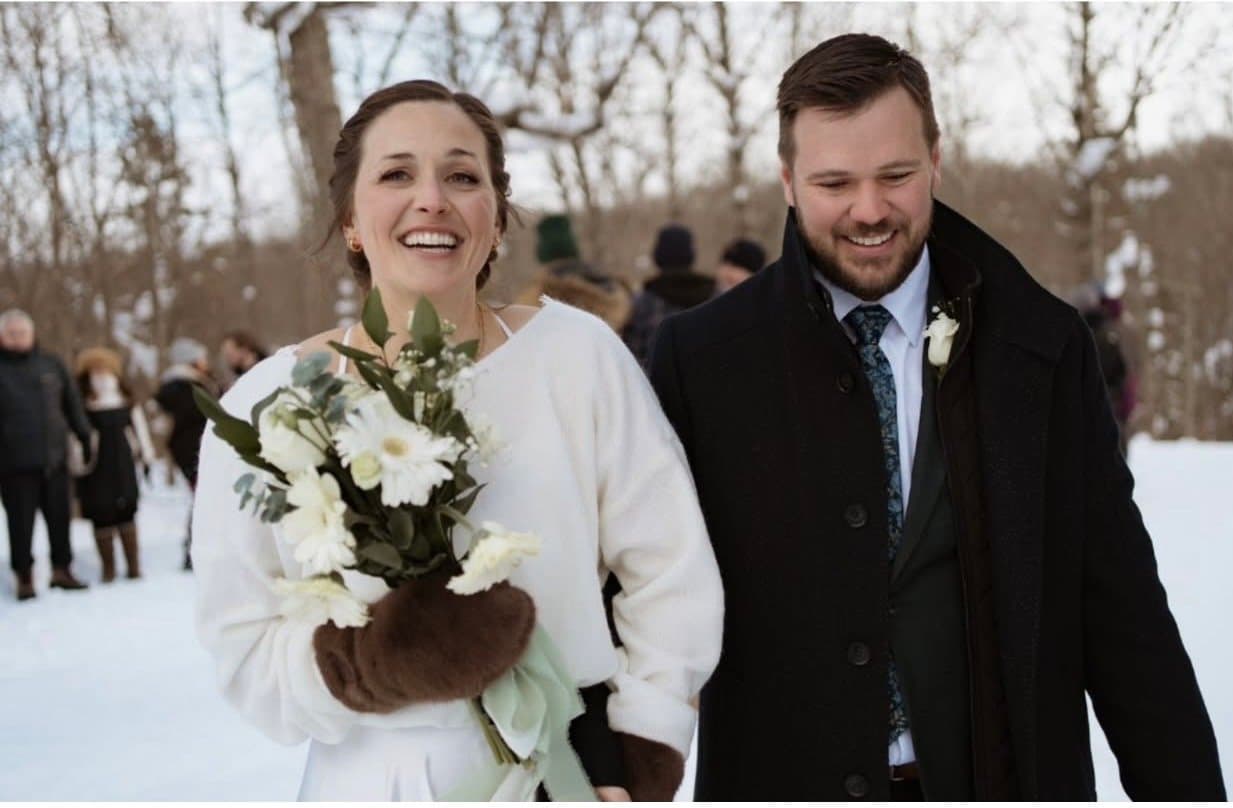 Winter bride and groom laughing