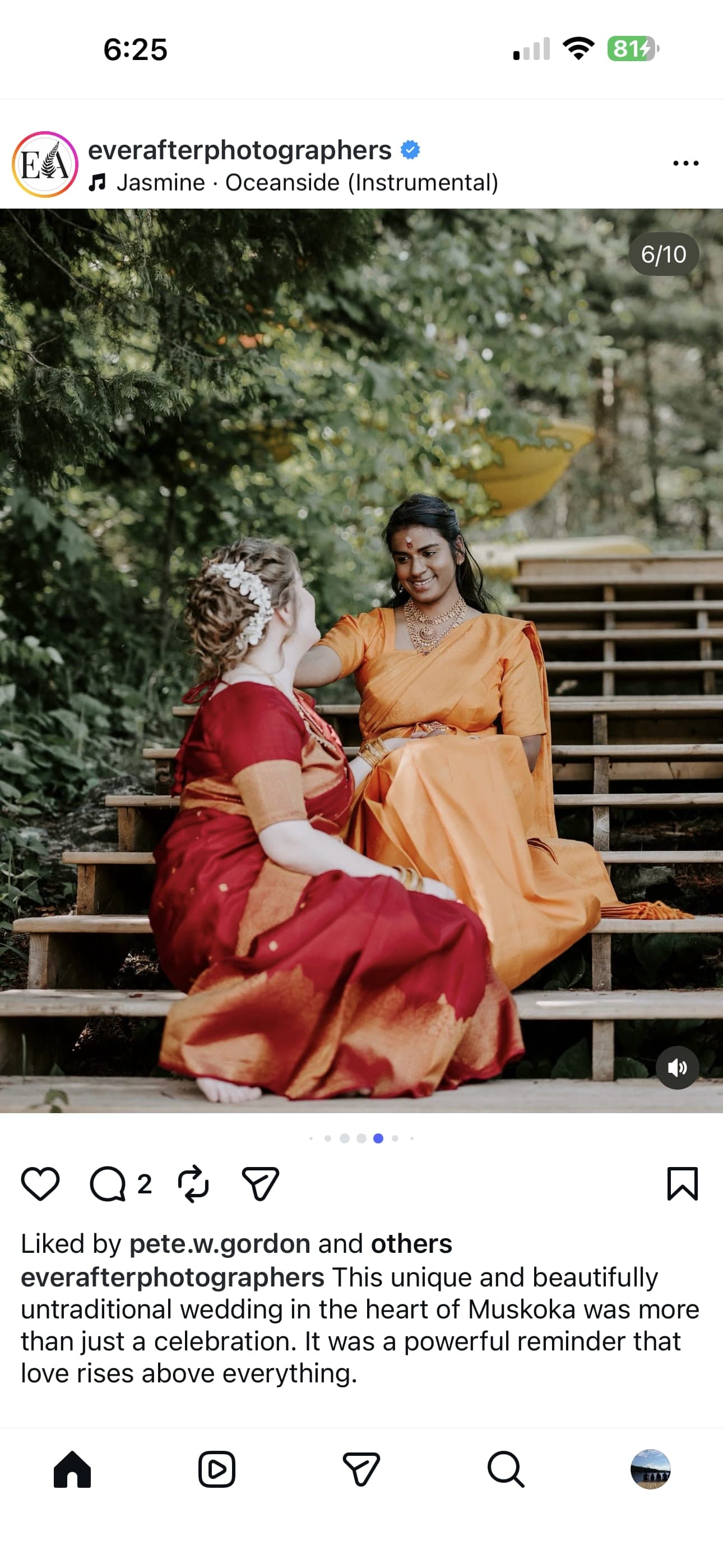 Bride and friend seated on the steps